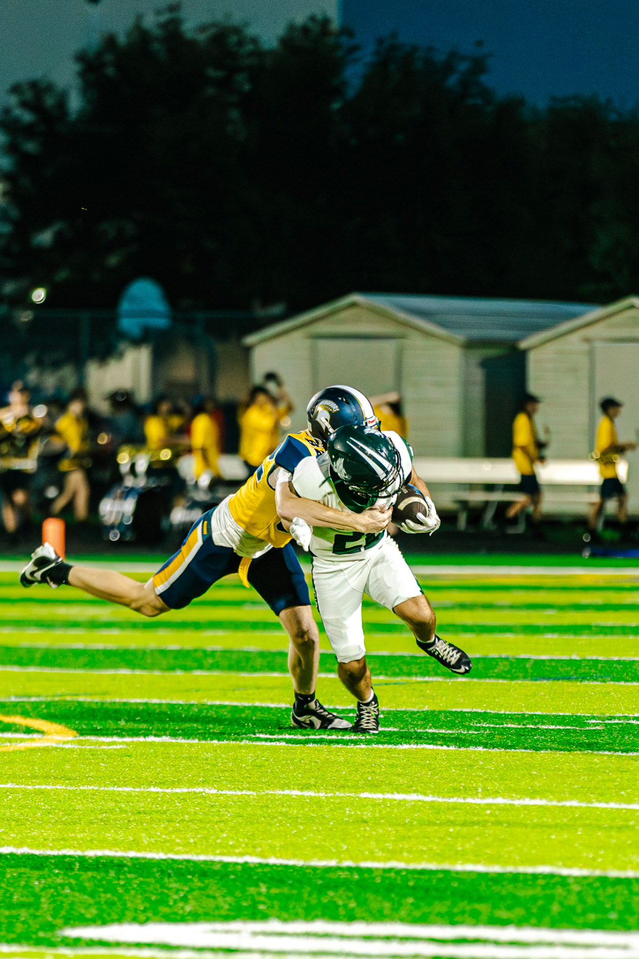 Defender diving to tackle a Sickles ball carrier